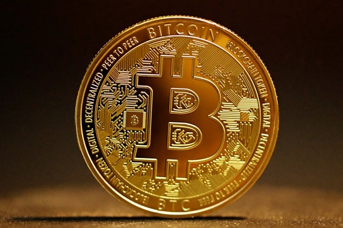 Golden bitcoin coin on a dark background